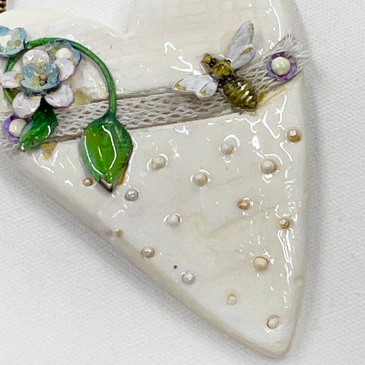 Handmade Heartfelt Ornament 14: hand sculpted heart with mixed media hand-painted enameled flowers by artist Tammy Tutterow