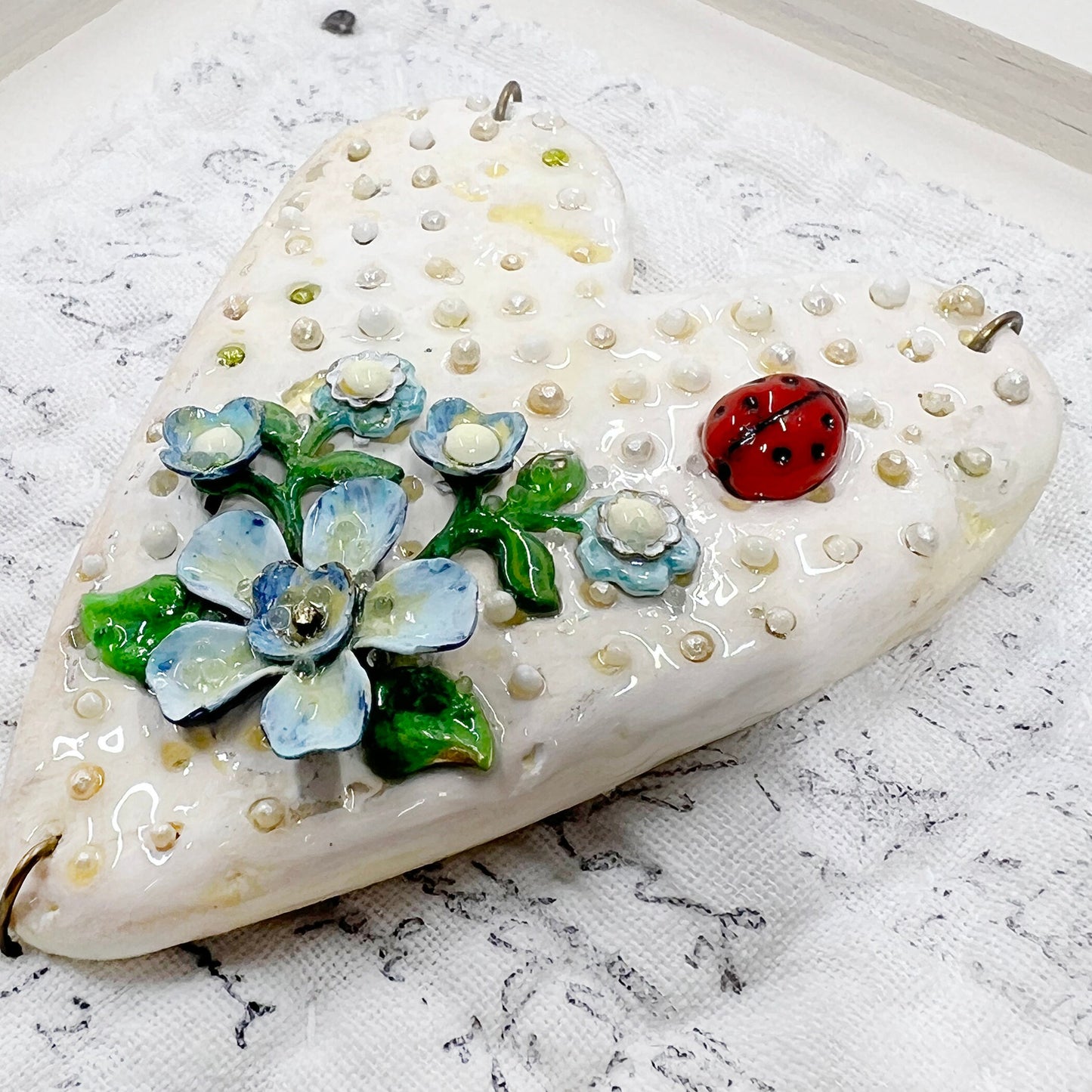 Handmade Heartfelt Sampler 1: framed hand sculpted heart with hand-painted enameled flowers by artist Tammy Tutterow