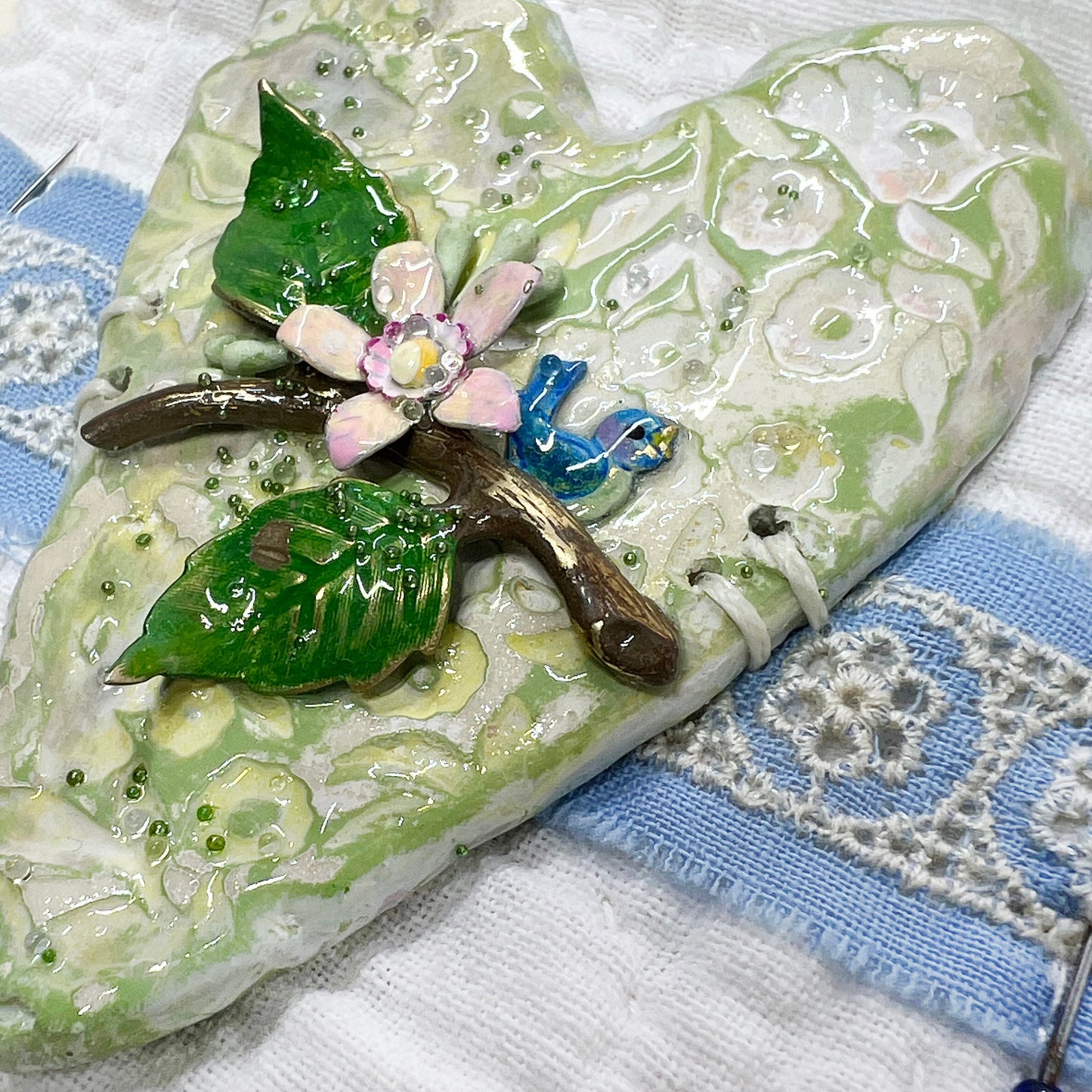Handmade Heartfelt Sampler 14: framed hand sculpted heart with hand-painted enameled flowers by artist Tammy Tutterow