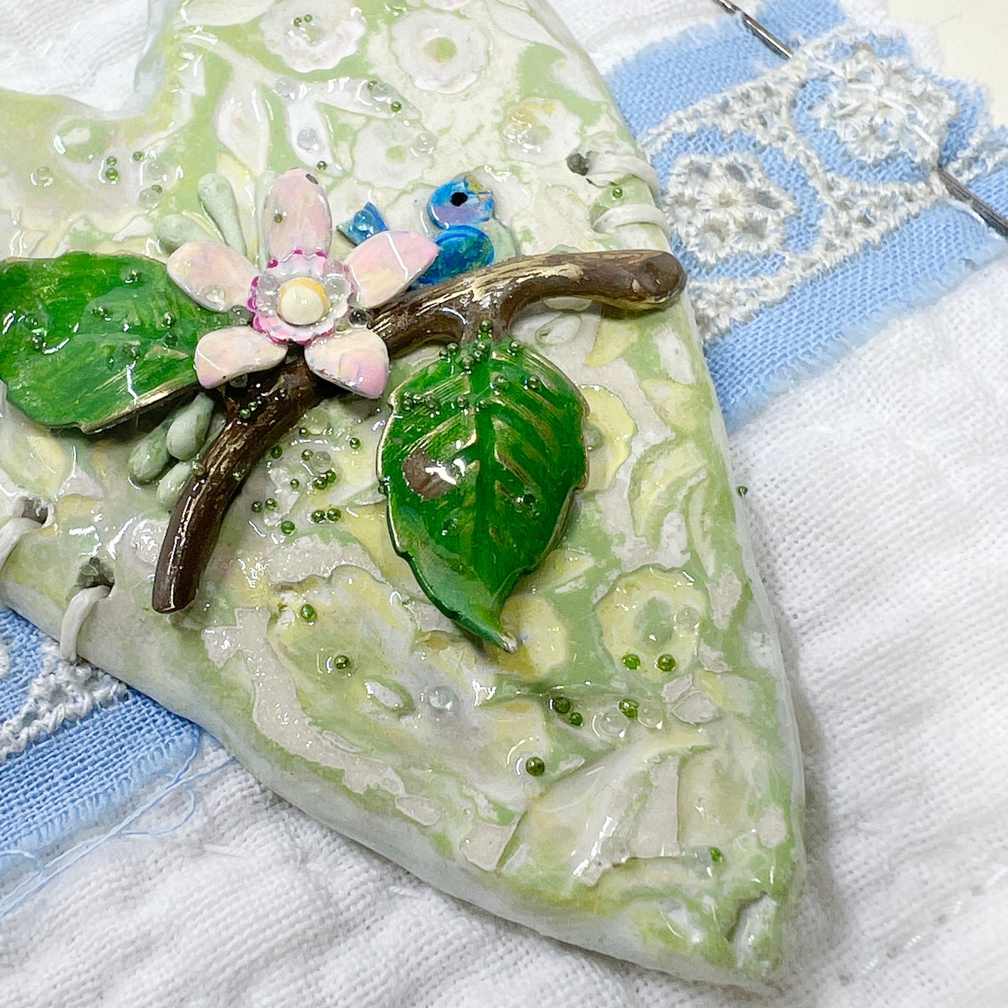 Handmade Heartfelt Sampler 14: framed hand sculpted heart with hand-painted enameled flowers by artist Tammy Tutterow