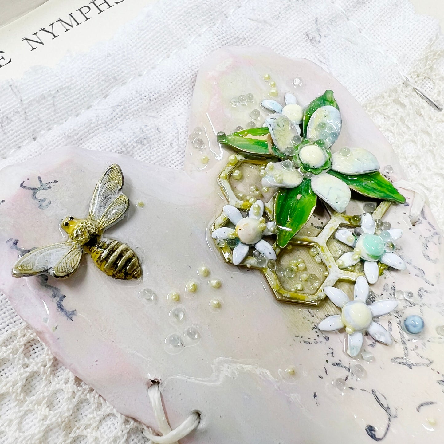 Handmade Heartfelt Sampler 16: framed hand sculpted heart with hand-painted enameled flowers by artist Tammy Tutterow