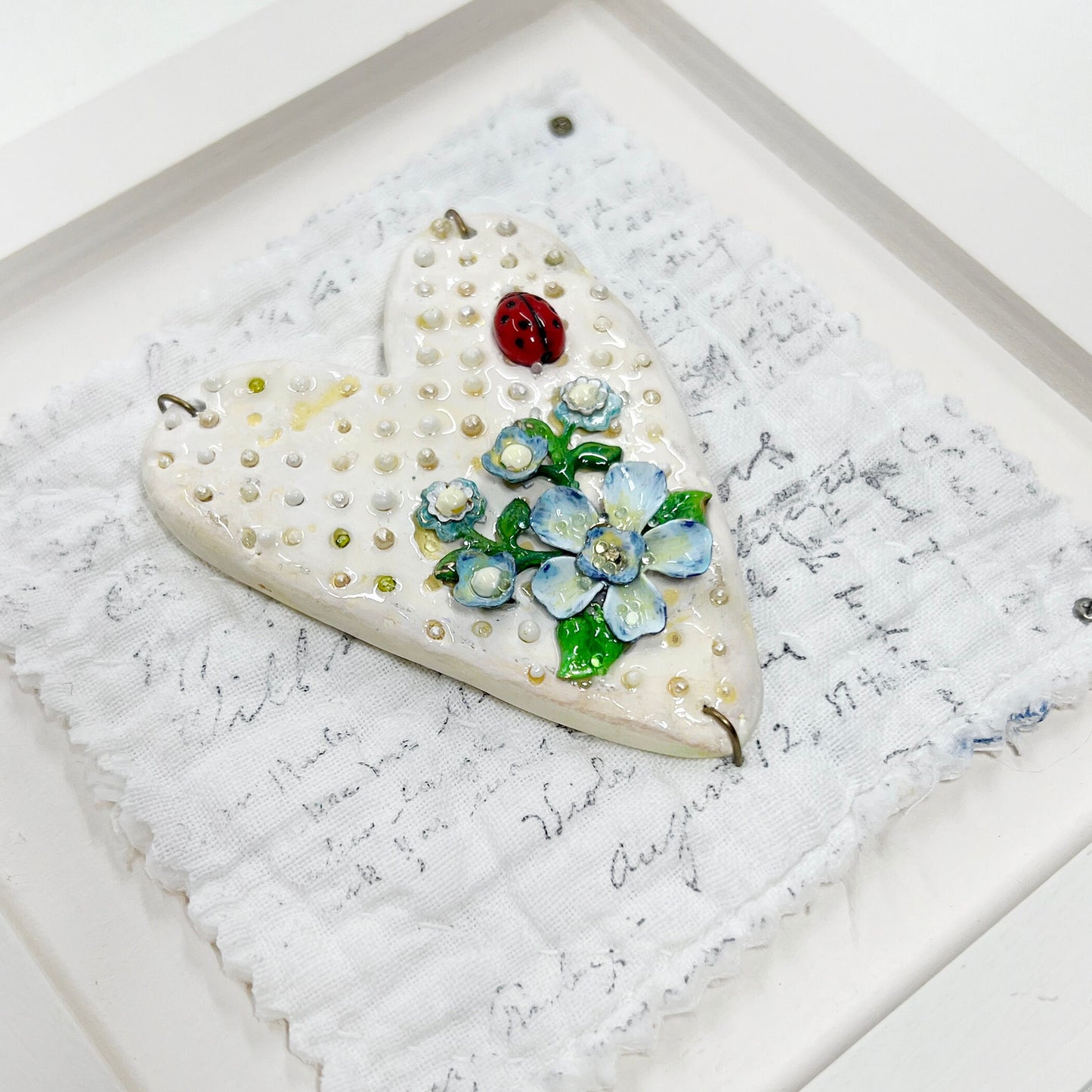 Handmade Heartfelt Sampler 1: framed hand sculpted heart with hand-painted enameled flowers by artist Tammy Tutterow