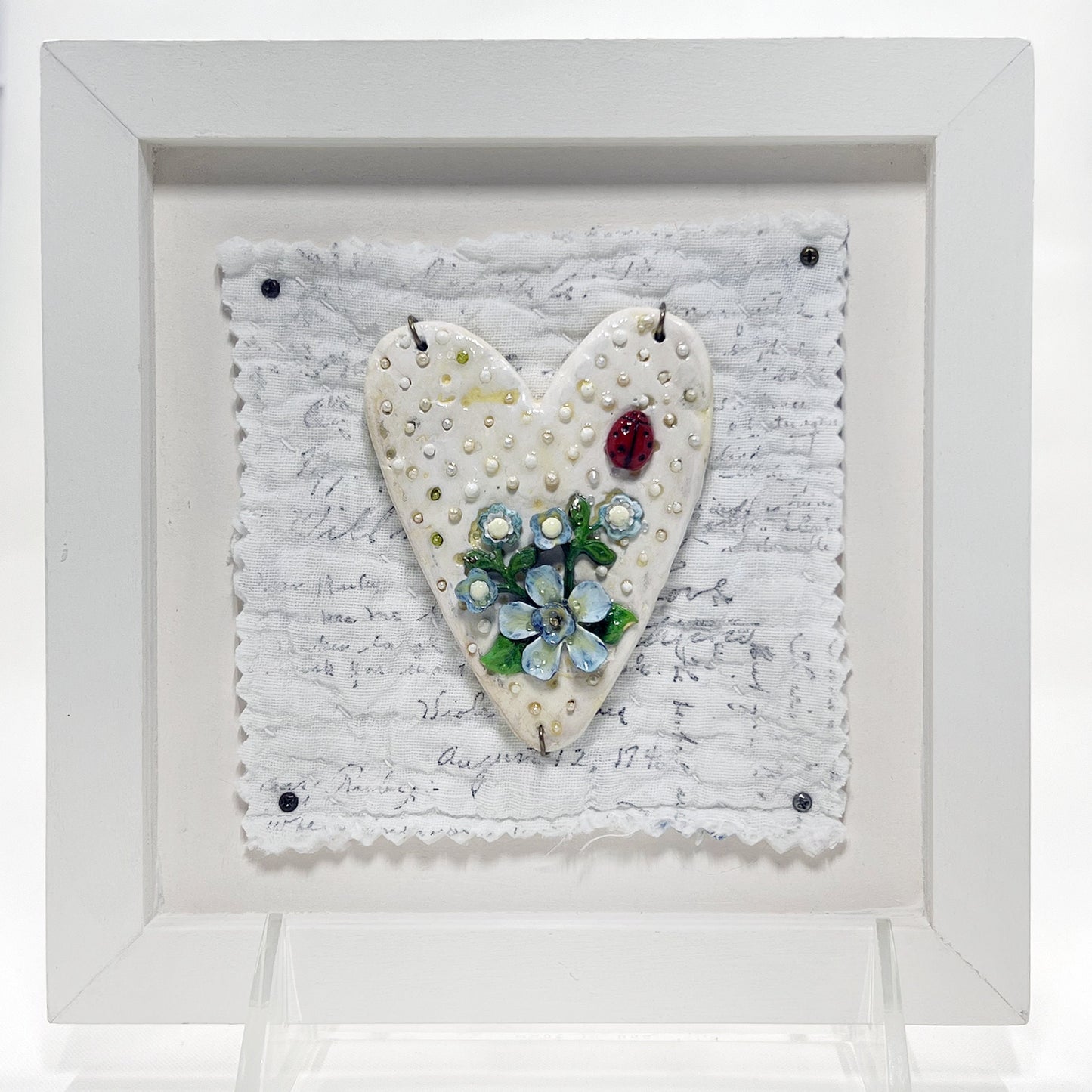 Handmade Heartfelt Sampler 1: framed hand sculpted heart with hand-painted enameled flowers by artist Tammy Tutterow