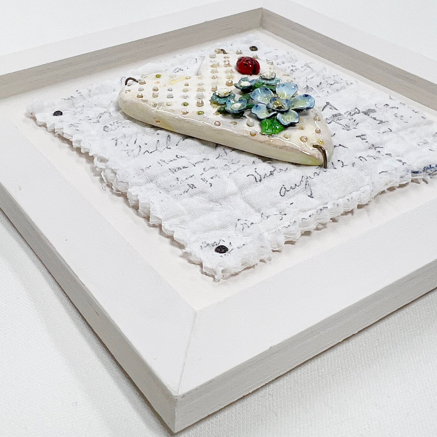 Handmade Heartfelt Sampler 1: framed hand sculpted heart with hand-painted enameled flowers by artist Tammy Tutterow
