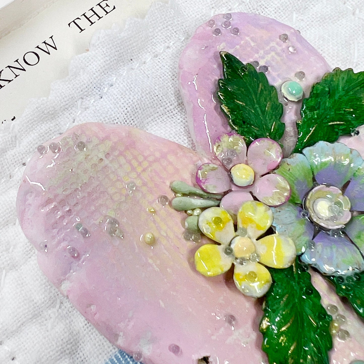 Handmade Heartfelt Sampler 9: framed hand sculpted heart with hand-painted enameled flowers by artist Tammy Tutterow