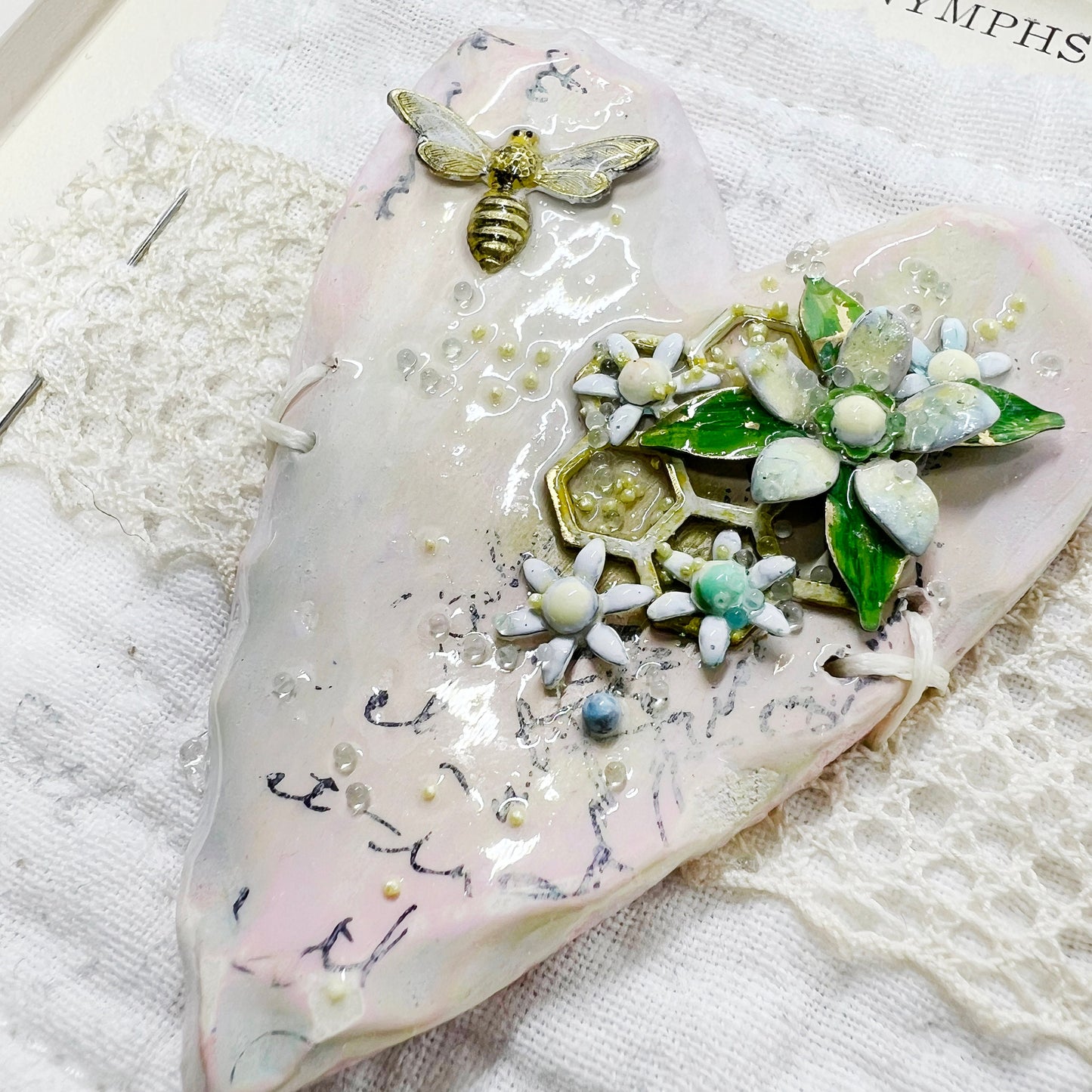 Handmade Heartfelt Sampler 16: framed hand sculpted heart with hand-painted enameled flowers by artist Tammy Tutterow