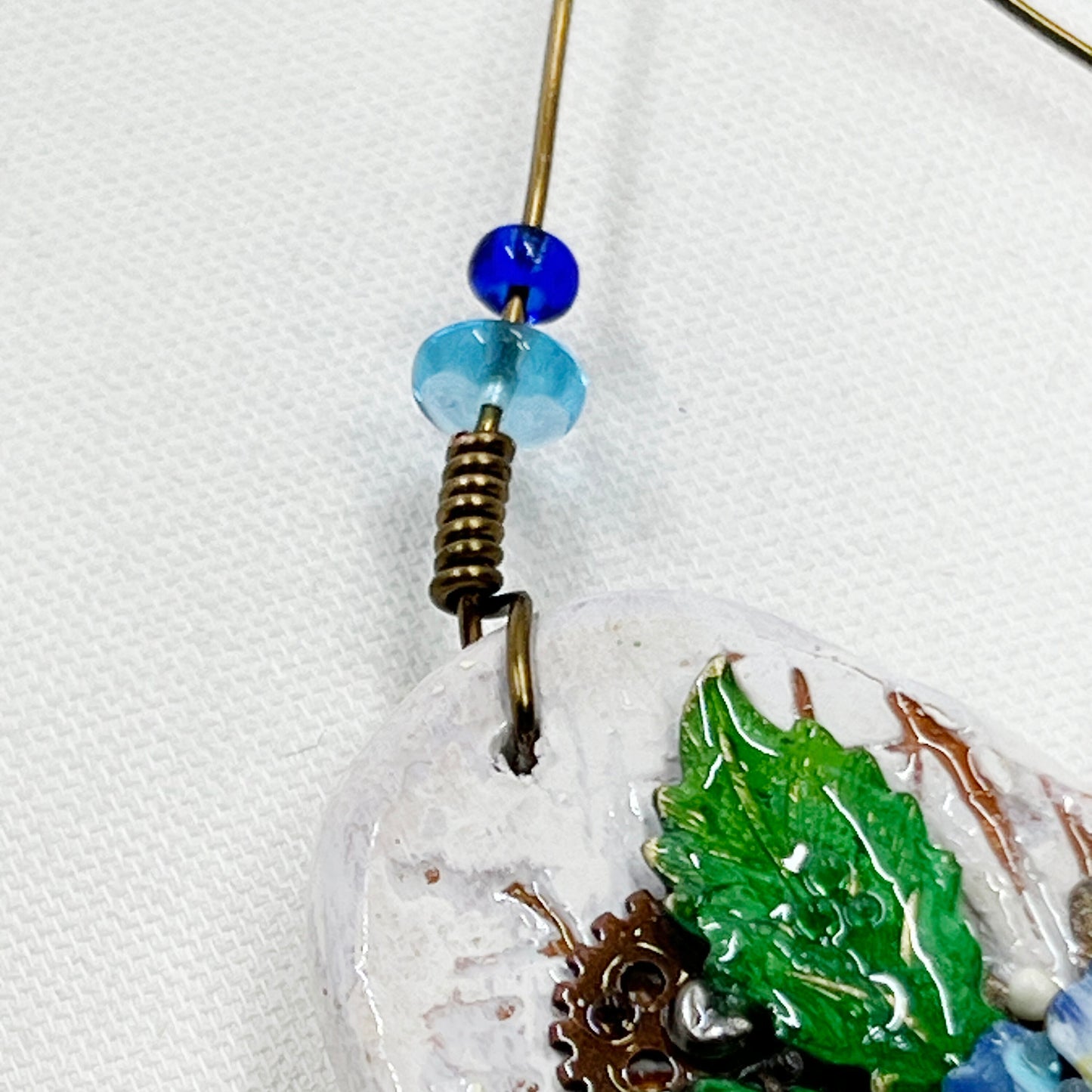 Handmade Heartfelt Ornament 8: hand sculpted heart with mixed media hand-painted enameled flowers by artist Tammy Tutterow