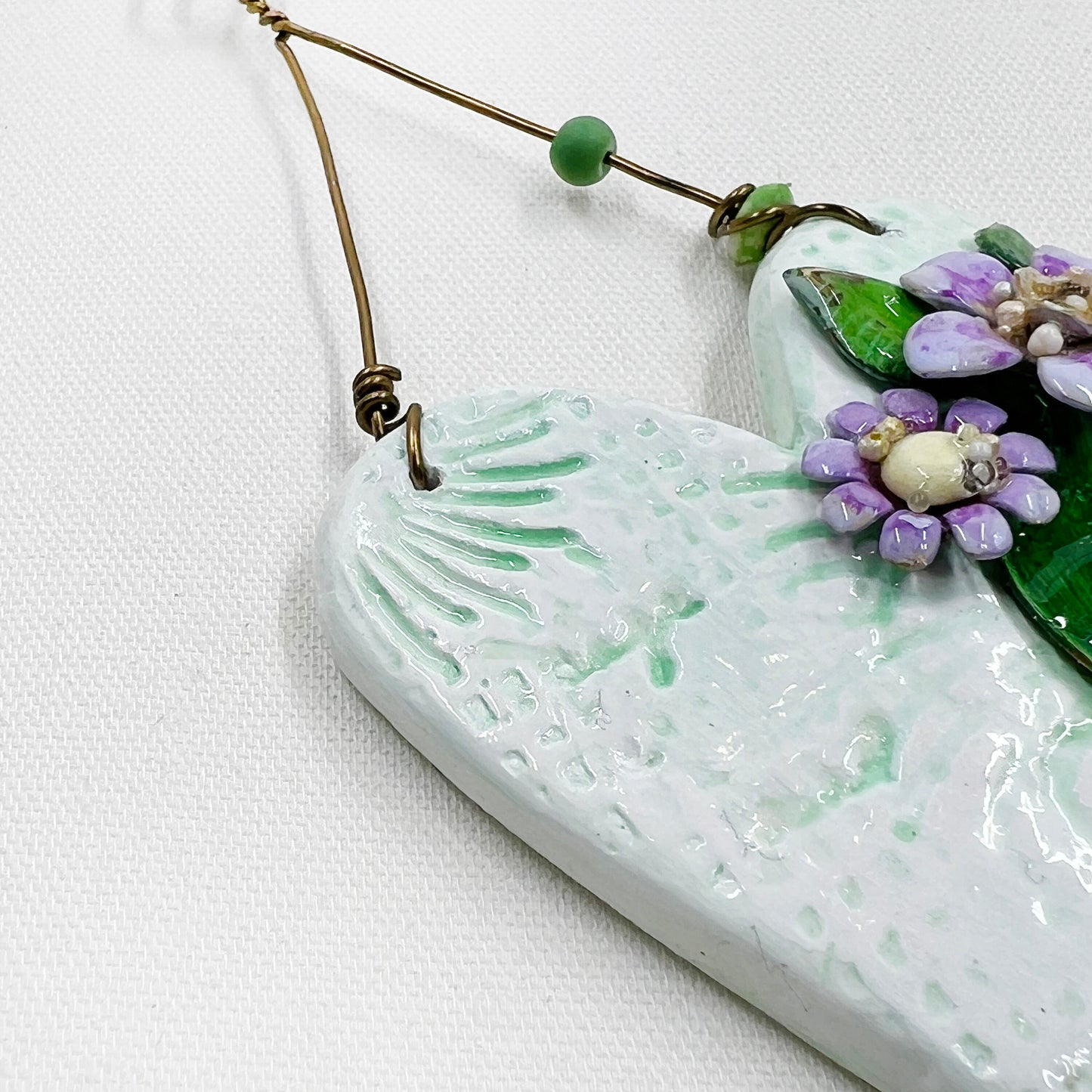 Handmade Heartfelt Ornament 13: hand sculpted heart with mixed media hand-painted enameled flowers by artist Tammy Tutterow