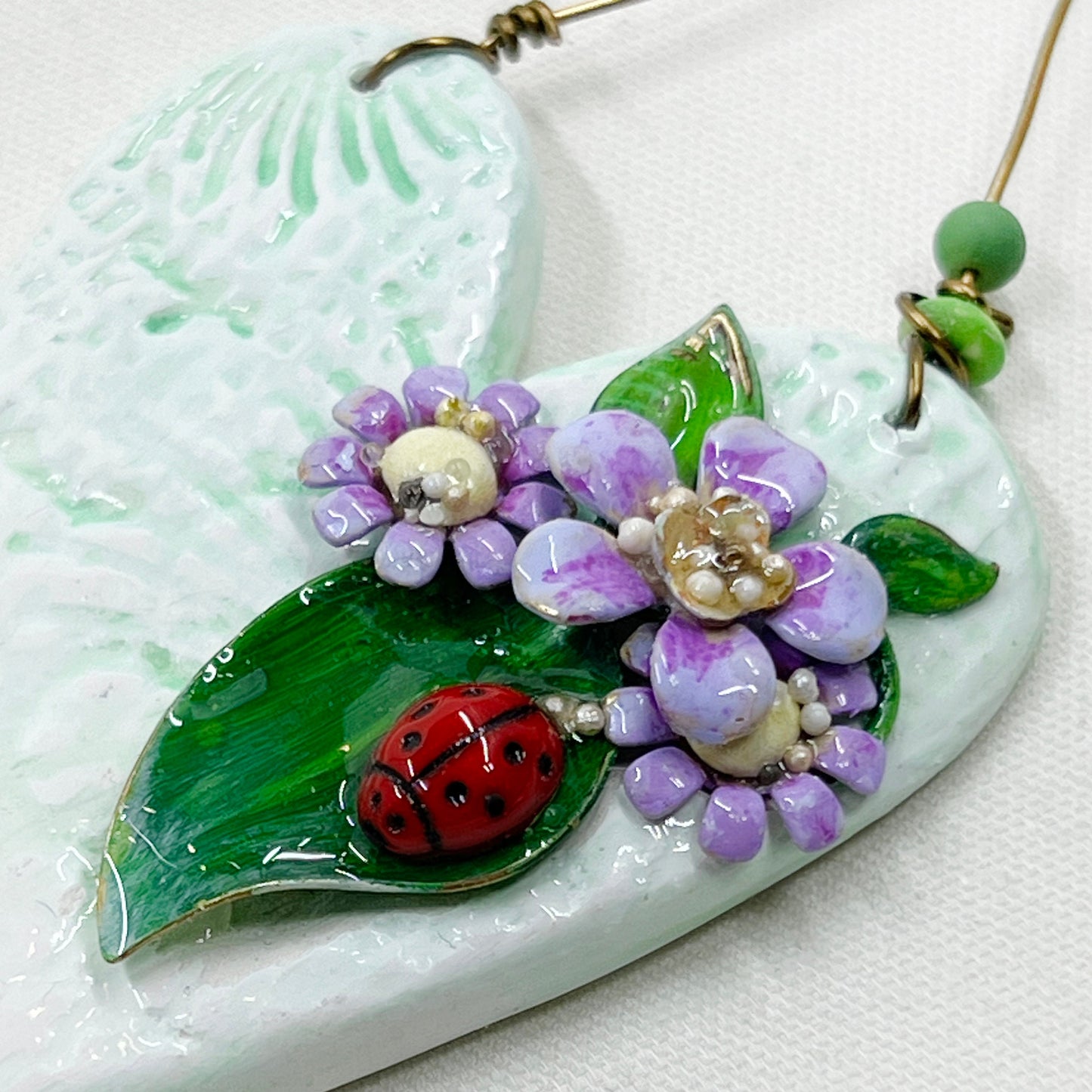 Handmade Heartfelt Ornament 13: hand sculpted heart with mixed media hand-painted enameled flowers by artist Tammy Tutterow